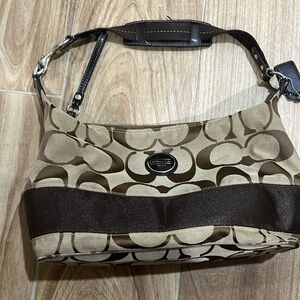 Feel free to grab this hobo Coach bag .